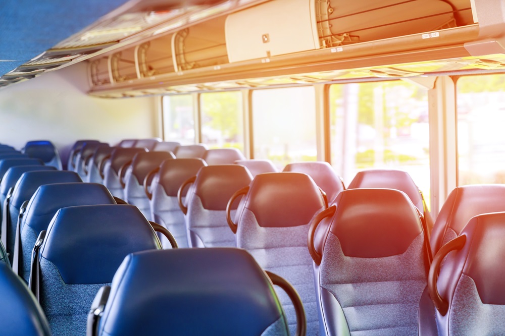 Blue seat in interior of coach seats in tourist bus